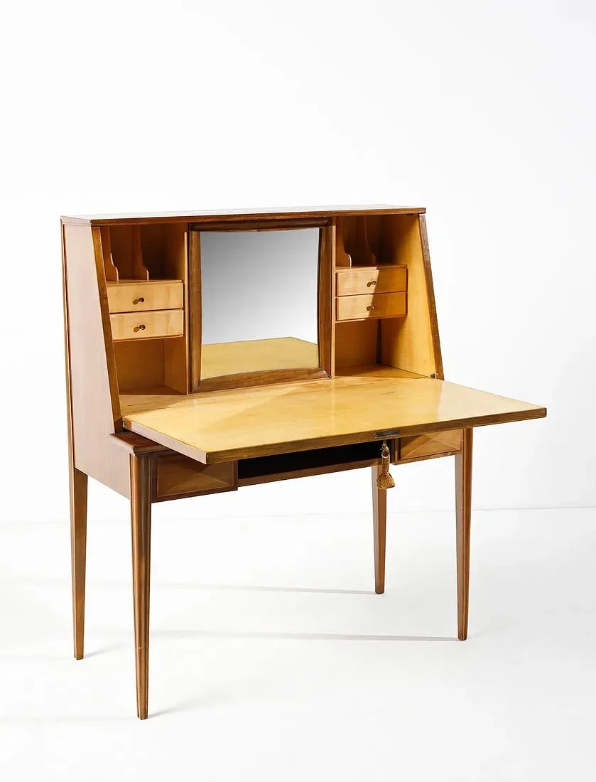 Vintage wooden secretary desk with fold-down writing surface and small drawers, set against a plain white background.