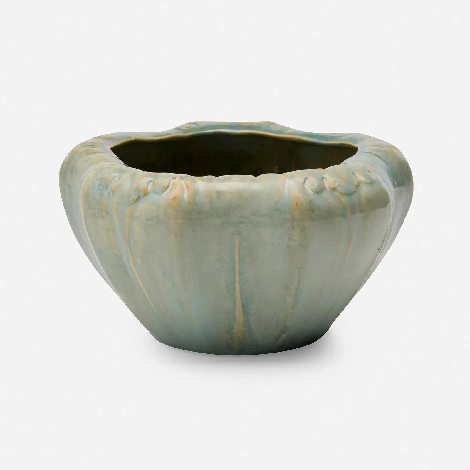 A ceramic vase with a rounded, fluted shape and a glazed surface featuring blue, beige, and green tones, with drip-like patterns running down from the rim.