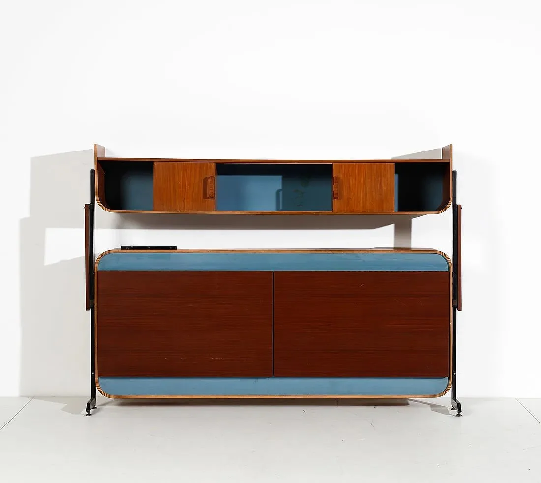 Mid-century modern wooden sideboard with blue accents, set against a white wall.