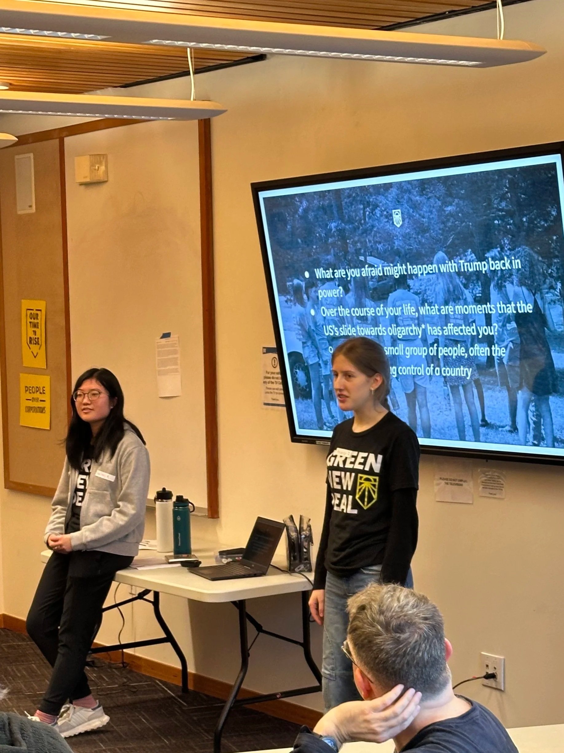 Two hub leads share information with the community about how to defend against an authoritarian at a Sunrise Teach-In.