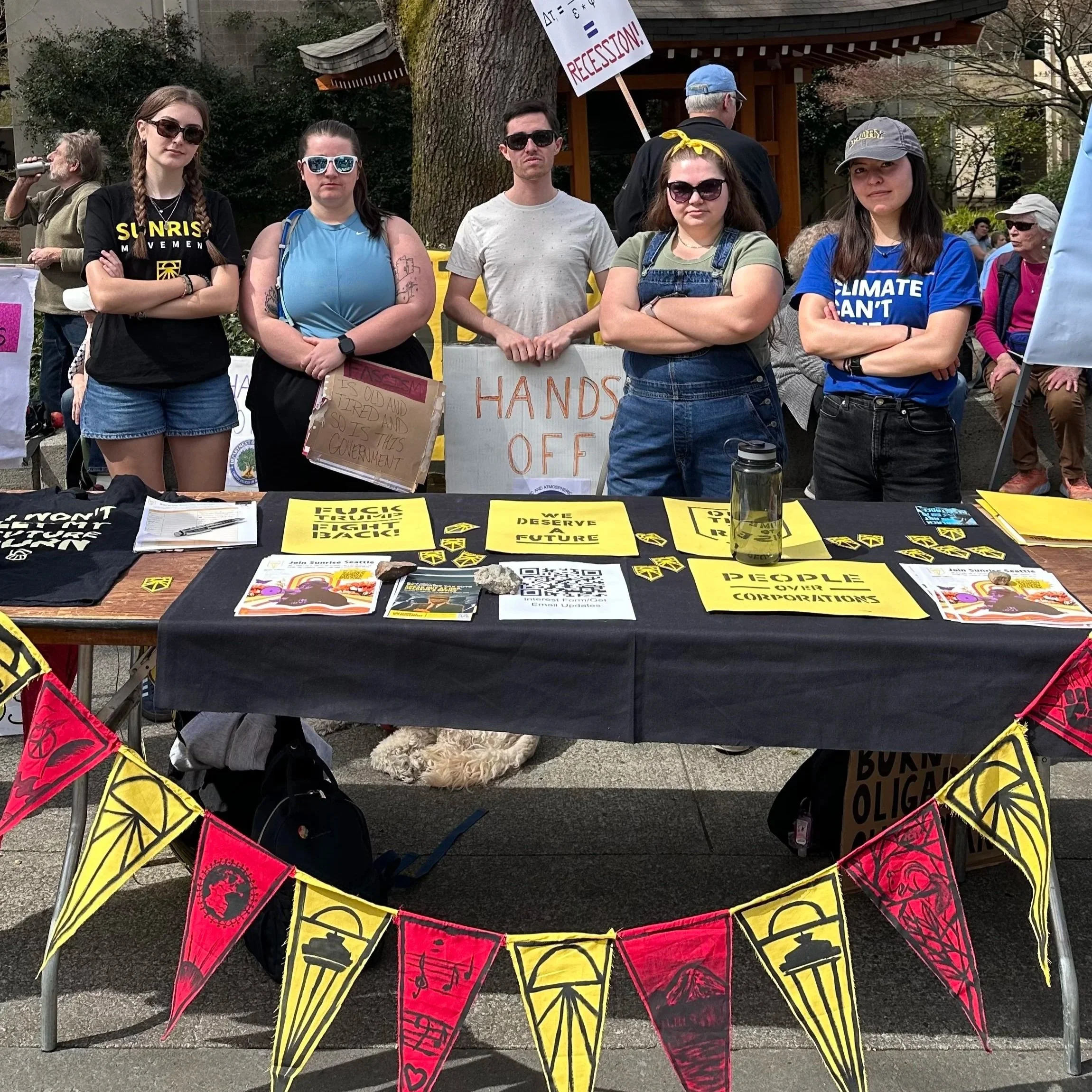 Sunrise members table at the Hands Off rally