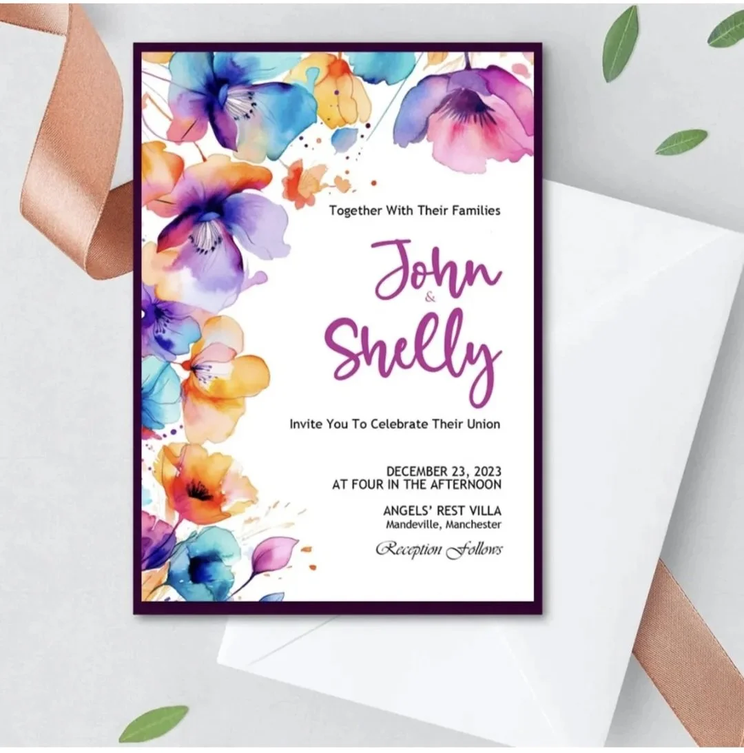 A colorful floral wedding invitation card with watercolor flowers on the border. The event is for John and Shelly's union, scheduled for December 23, 2023, at Angel's Rest Villa in Mandeville, Manchester, with reception to follow.