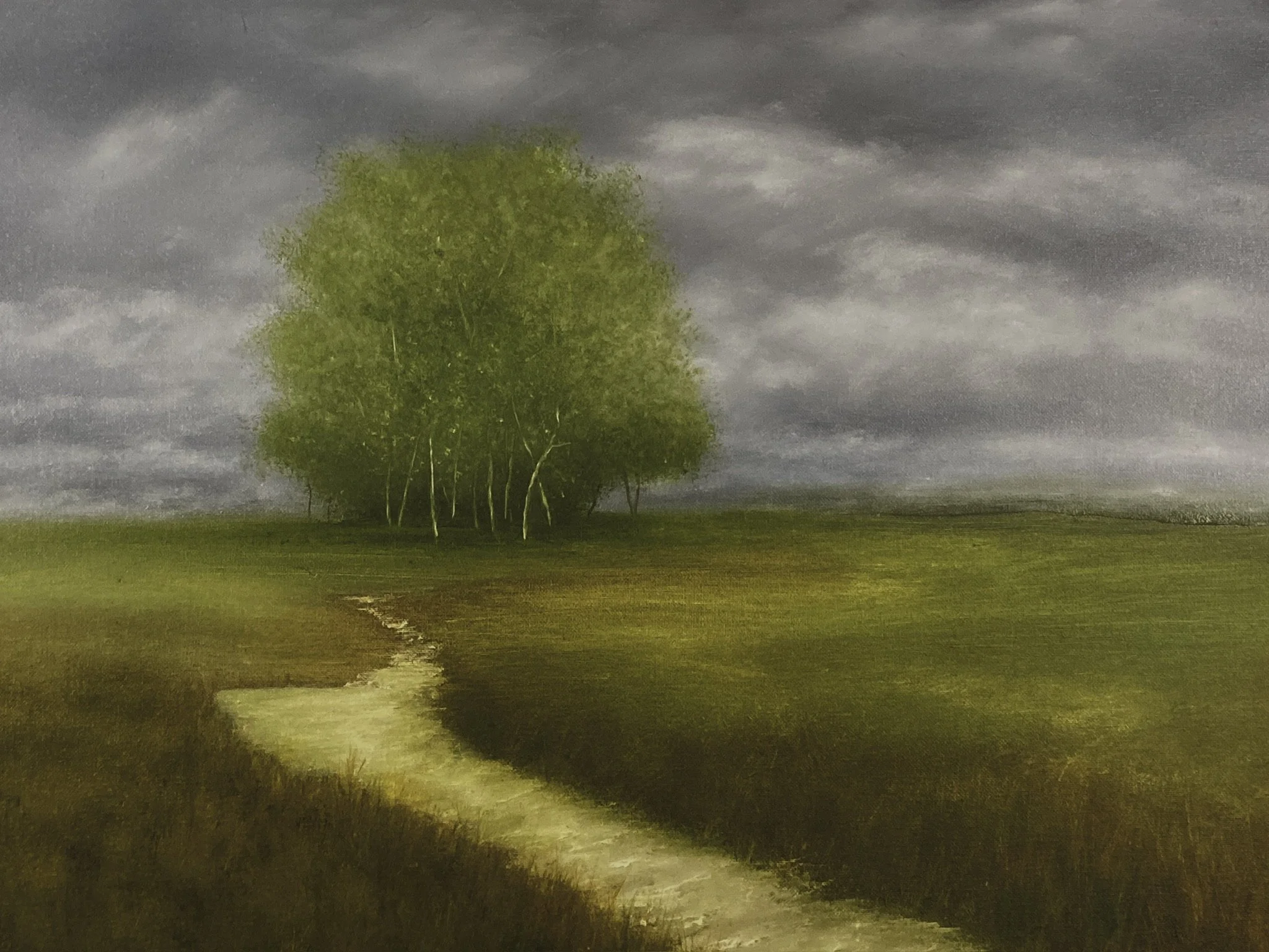 A painting of a single tree with green leaves on a grassy landscape under a cloudy sky, with a winding dirt path in the foreground.