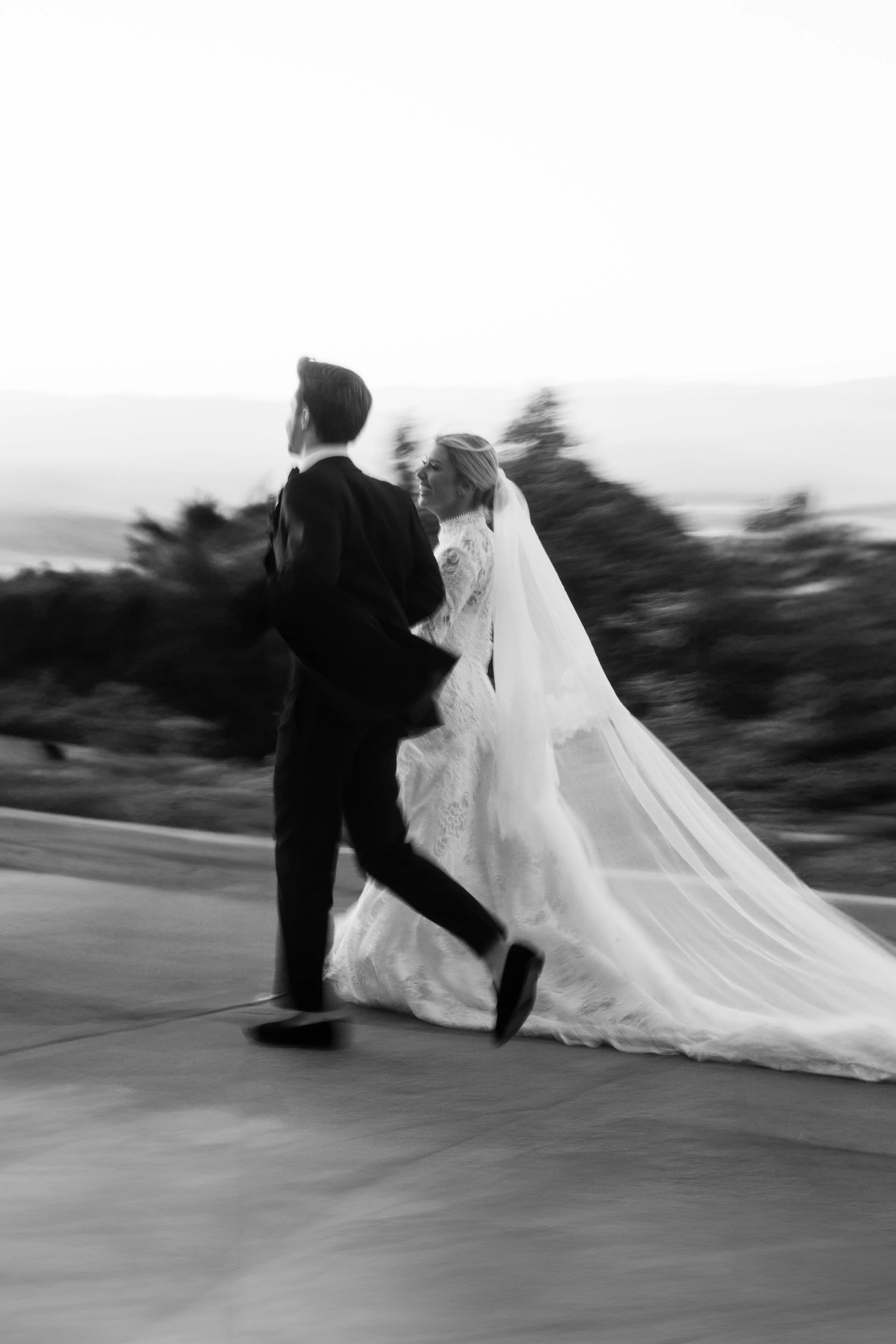 Bride and Groom Running During Couples Sunset Photos