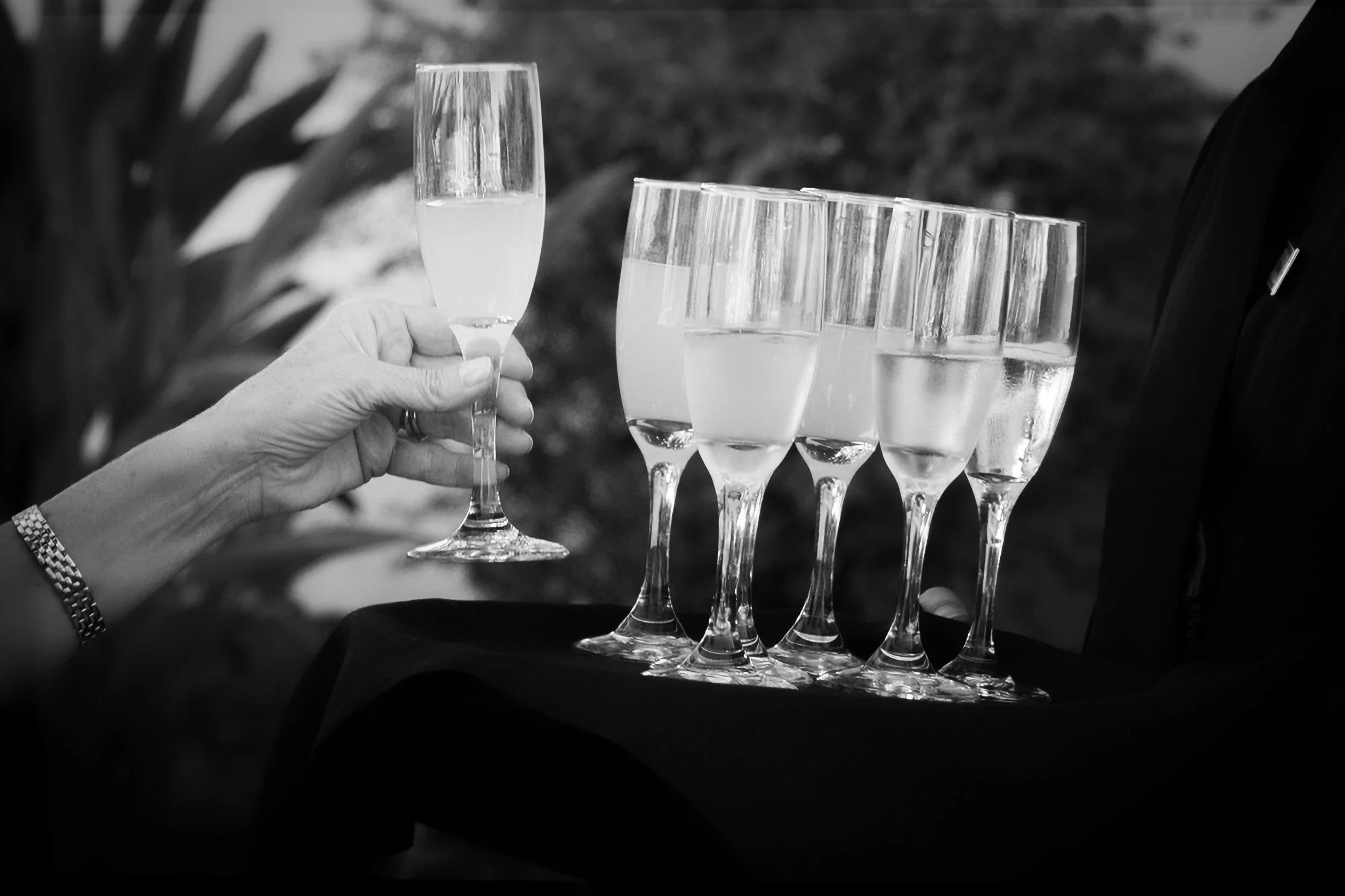 Guest Grabbing Champagne During Cocktail Hour 