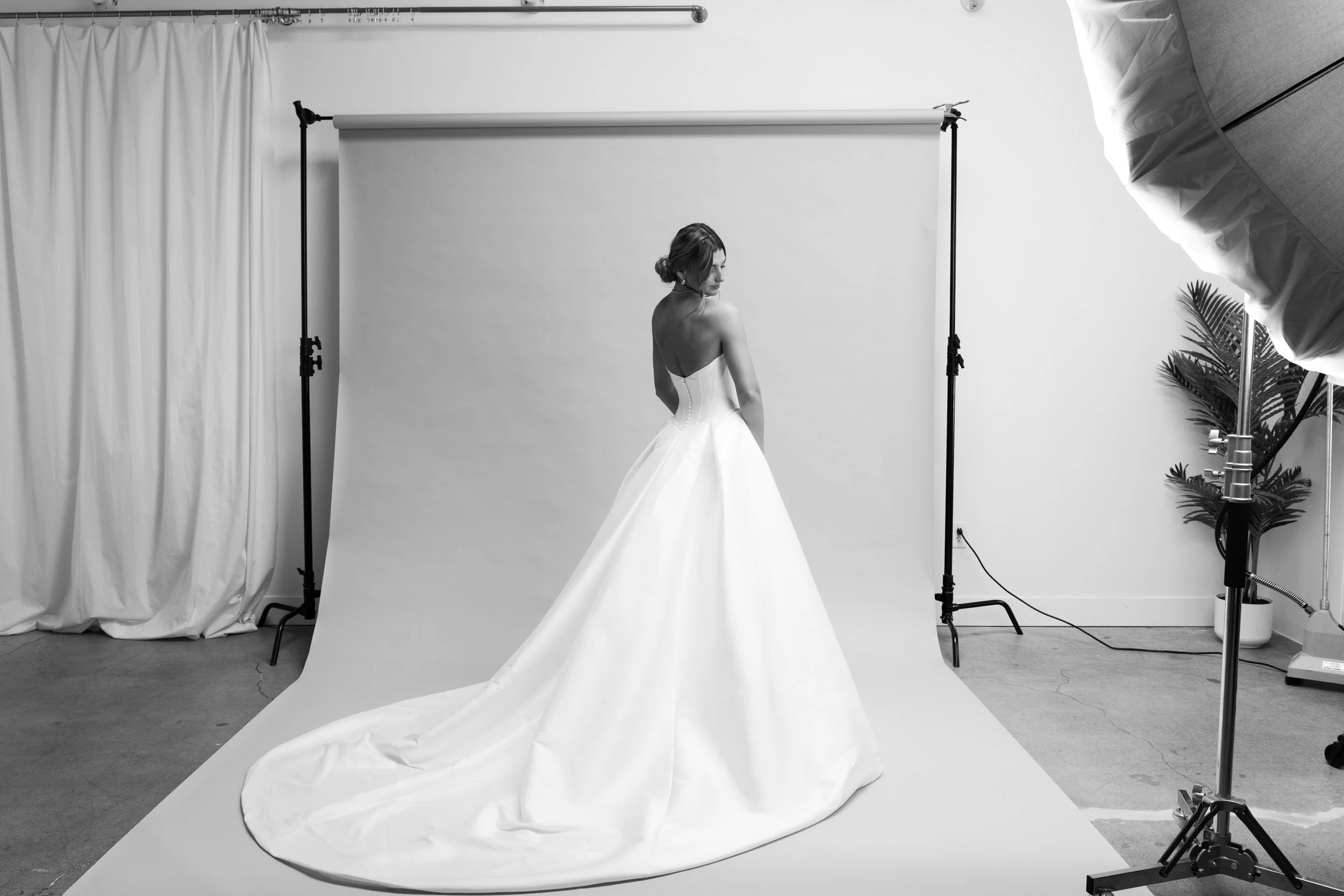 Bride Looking Over Shoulder in White Strapless Designer Wedding Dress in Los Angeles California. Photographed by Lillee Monet Photography
