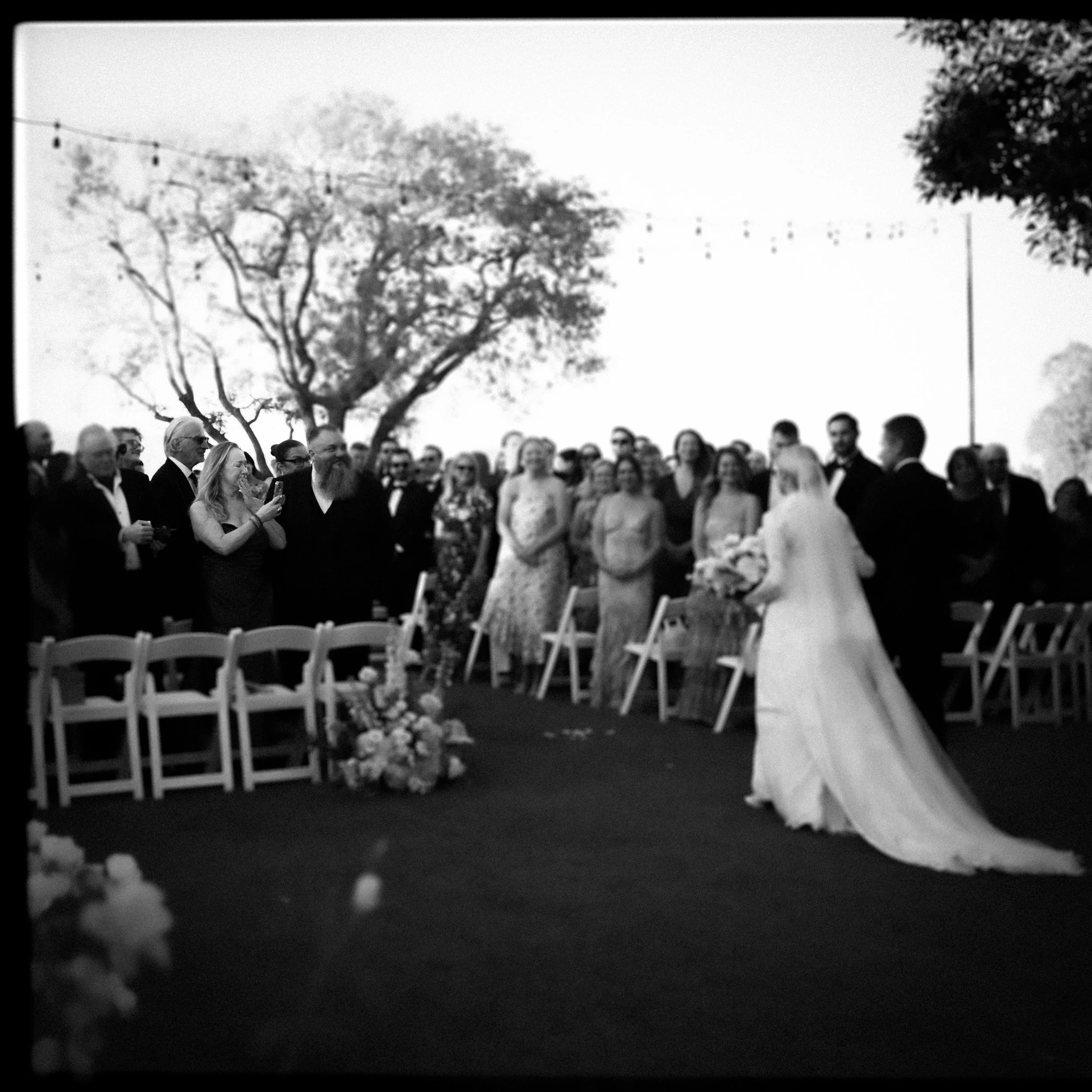 Wedding Guest Cries as Bride and Father Walk down the aisle at the Spanish Hills Club In Camarillo