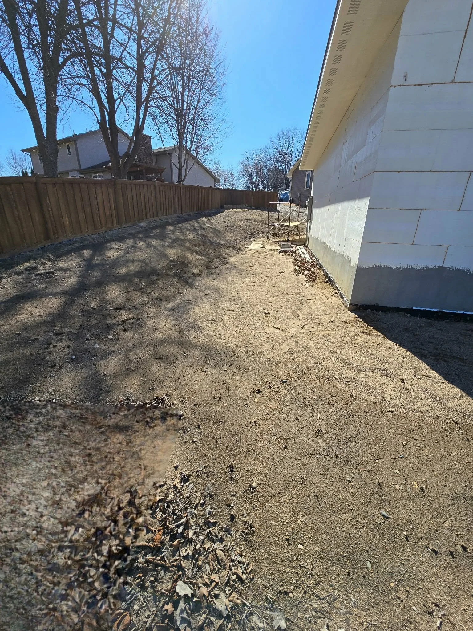 before backyard hardscape installation bare dirt yard preparation Plymouth Minnesota