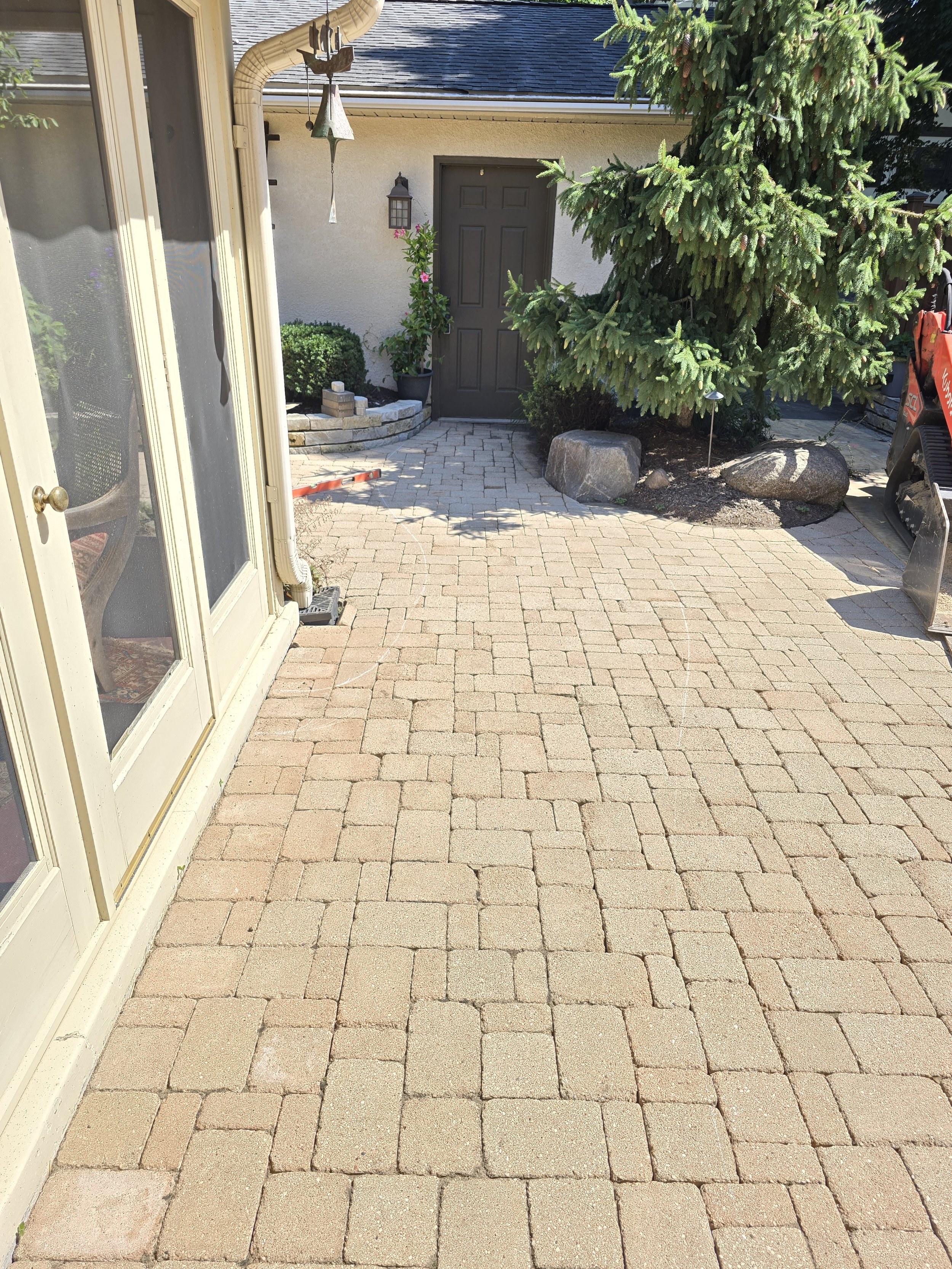 before paver patio with basic layout lacking defined walkway design