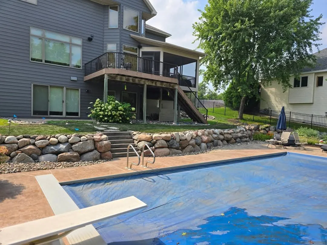 retaining wall with integrated patio and poolside hardscape Blaine Minnesota