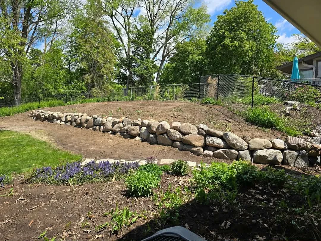 natural boulder retaining wall landscape design sloped yard