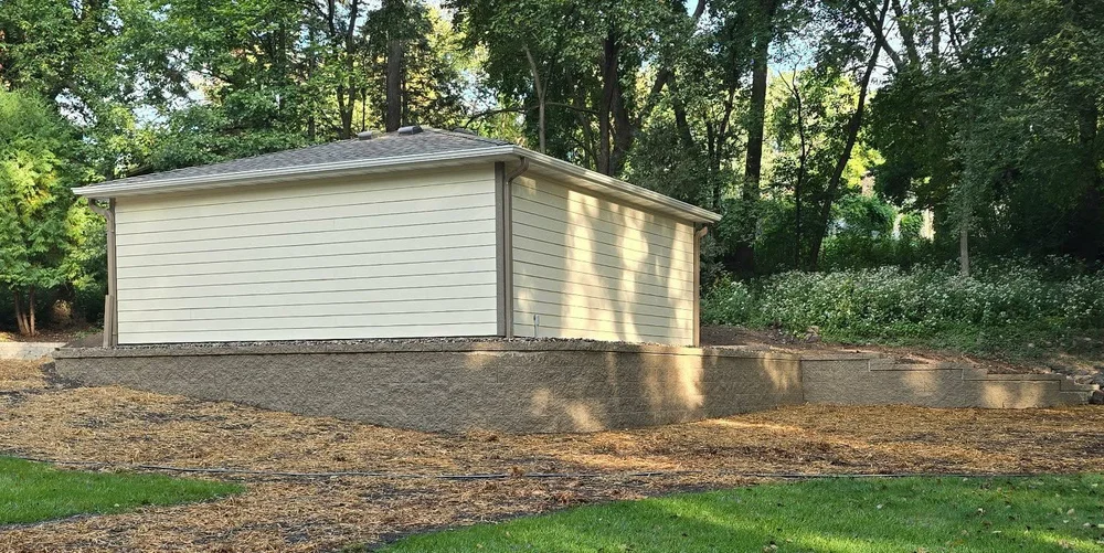Completed structural retaining wall installed by Gambit Hardscapes