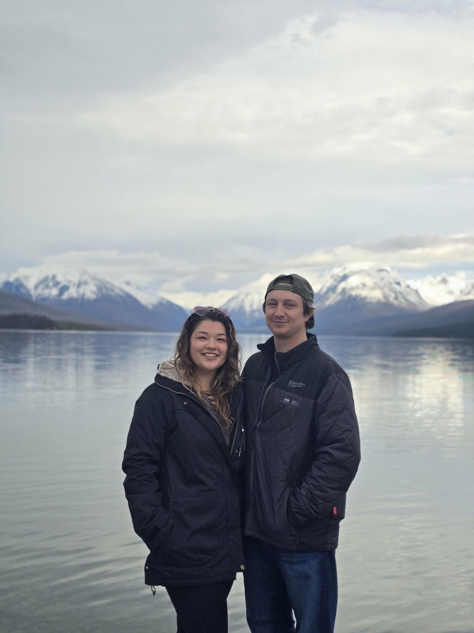 owners of Gambit Hardscapes husband and wife team outdoors by lake and mountains