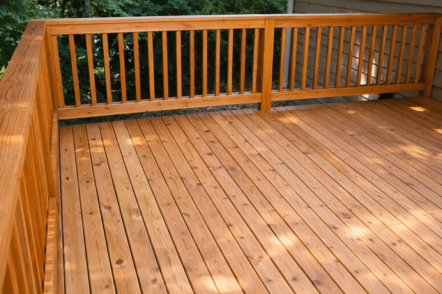 Cedar wood deck with warm tones and vertical railing detail in Liberty Hill Tx