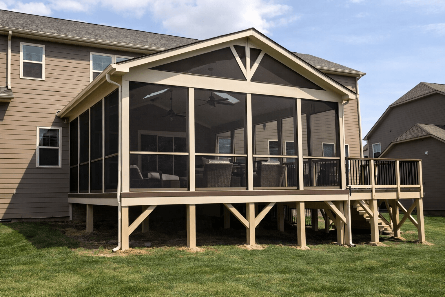 Screened-in porch deck with covered roof and elevated structure