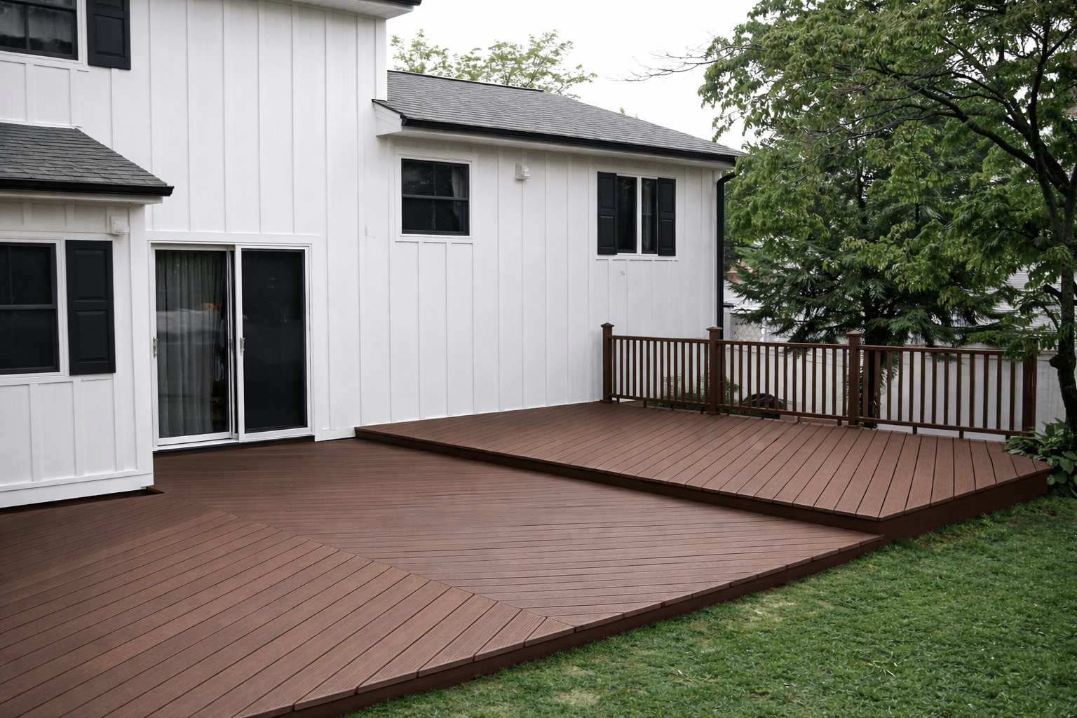 Ground level backyard deck with wide steps and clean layout