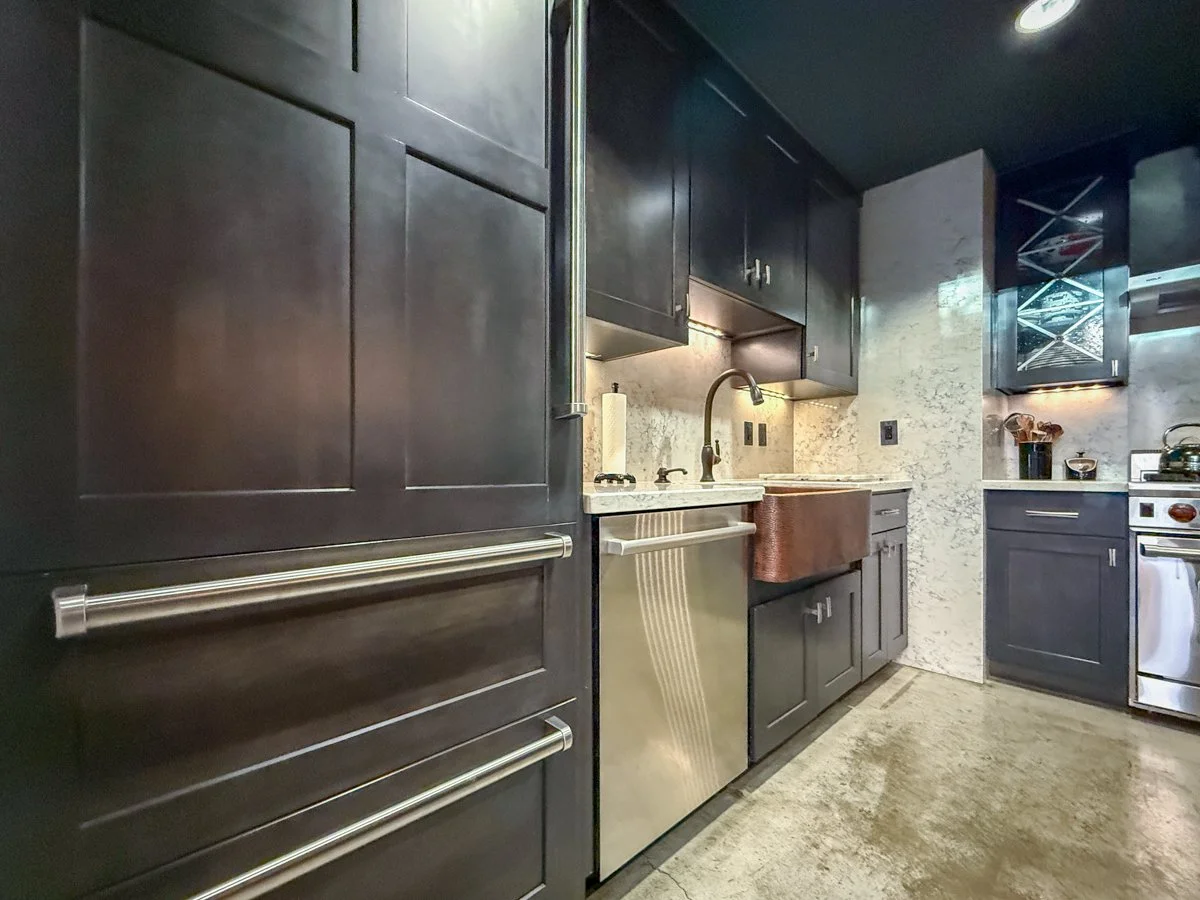 Remodeled kitchen with hand-made copper sink, wood cabinets, Dekton counters, Wolfe appliances.