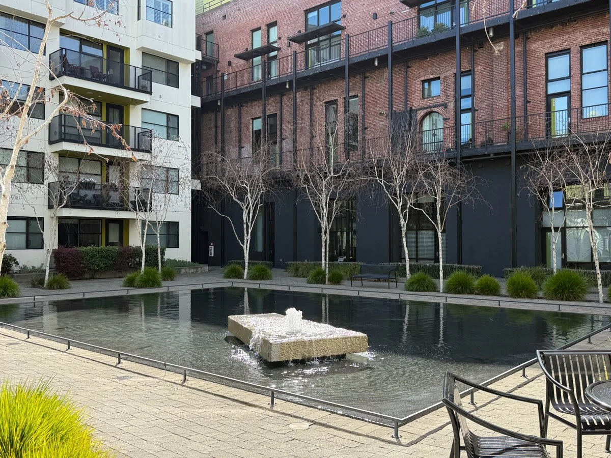 View from patio to Esprit south court with 24-hour water feature. 