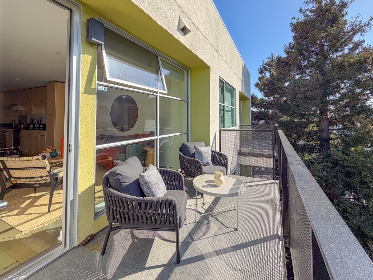 Balcony with view to redwood trees. 