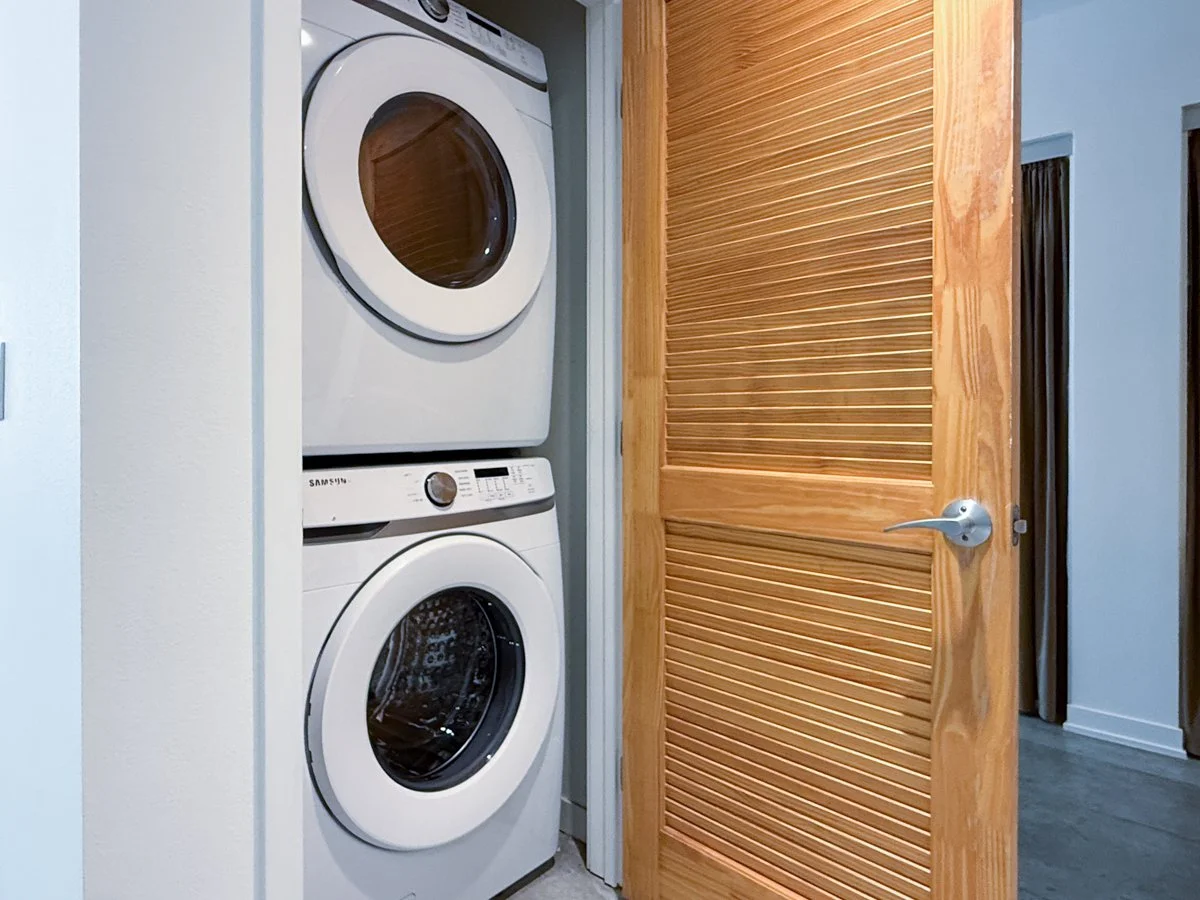 Laundry closet with washer and dryer.
