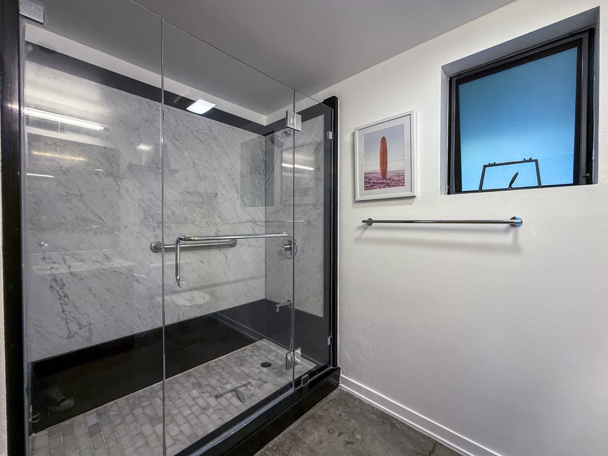 En suite primary bath with walk-in shower. 