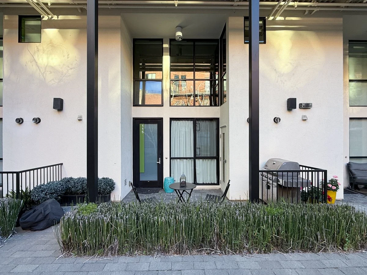 Entrance to unit 115 with your own patio space. Includes gas plumbed Weber grill 