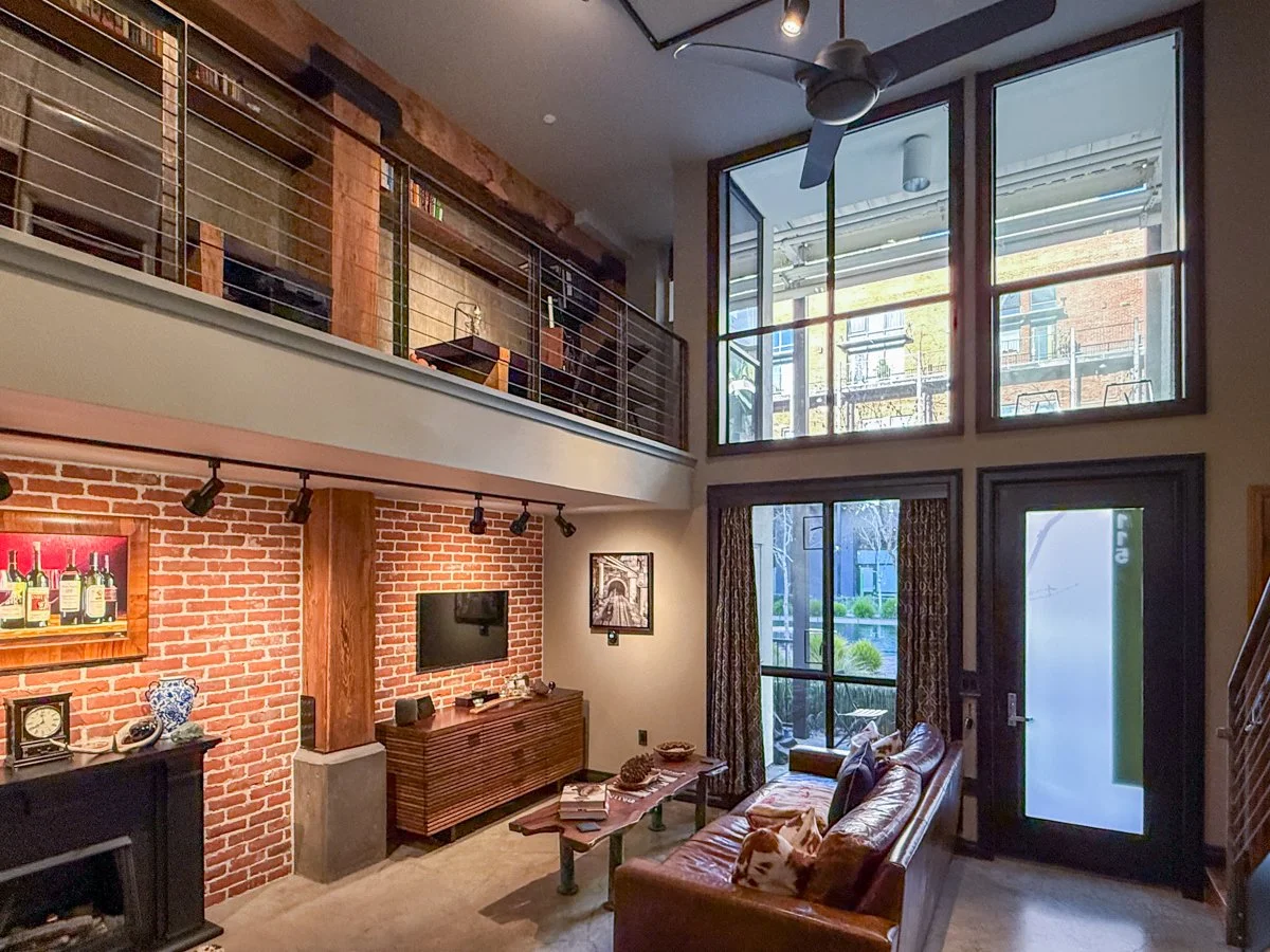 Full height windows let in natural light. 