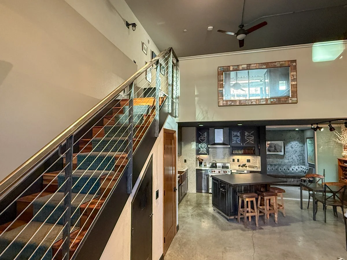 Wood stairway with custom steel and cable handrail. 