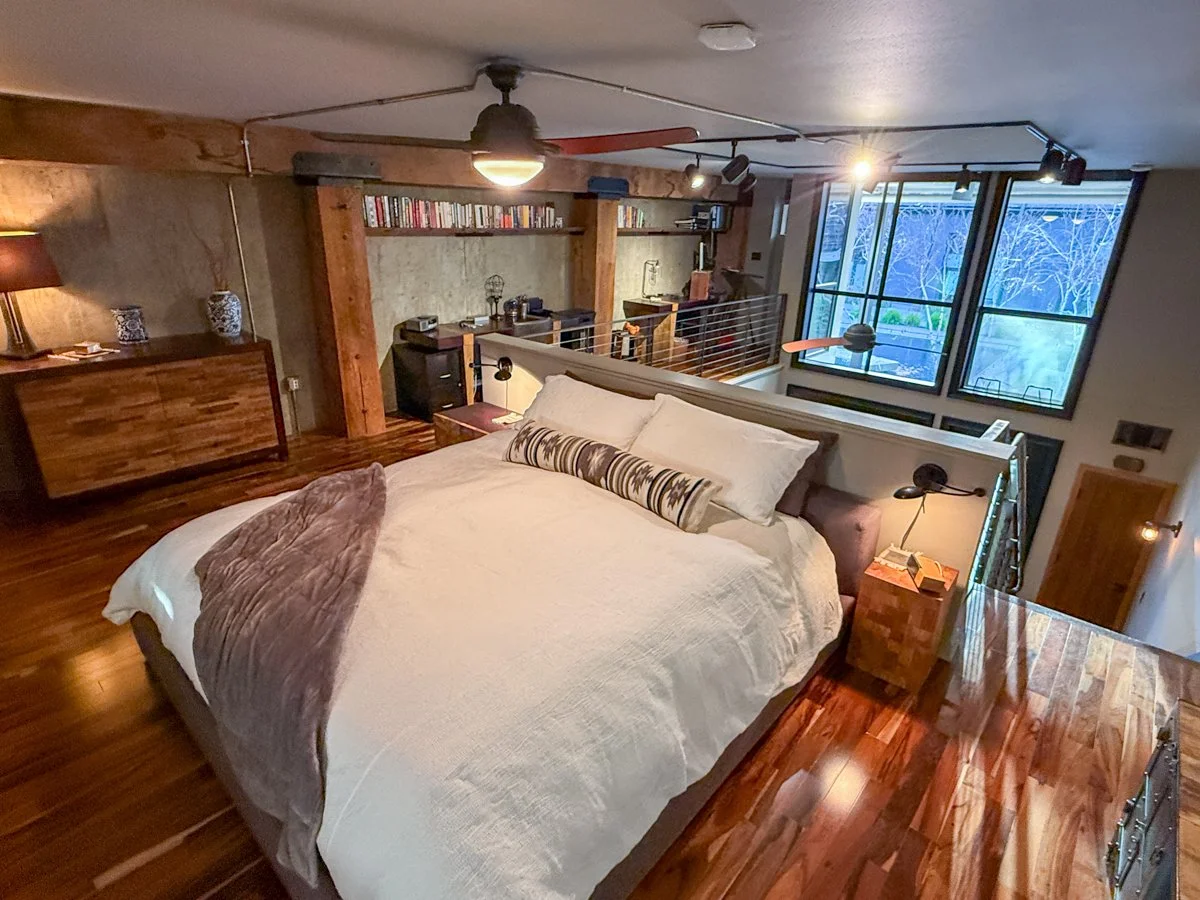 Loft primary bedroom with King Bed, redwood exposed beams. 