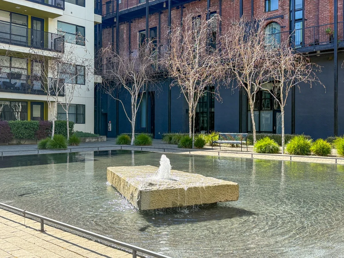 Unit faces south court atrium with 24 hour water element.