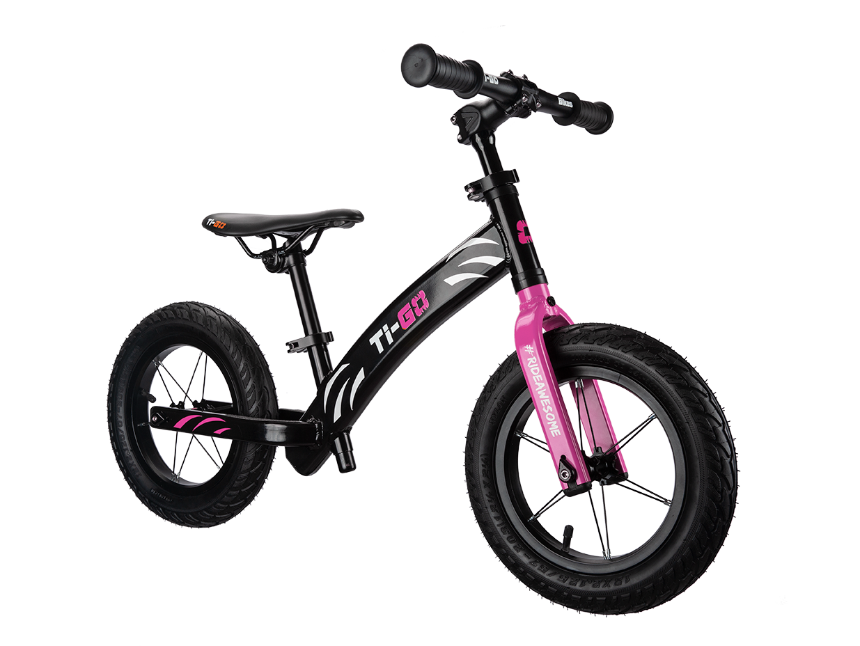 Black and pink children's balance bike with thick tires, handlebar grips, and a pink front fork with hashtag #KIDSAREAWESOME.