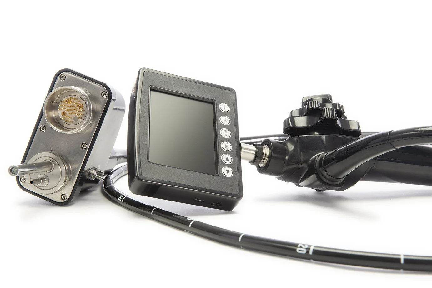 Close-up of medical equipment, including a catheter with multiple openings, a digital monitor, and a mechanical control with pipes, all set against a white background.