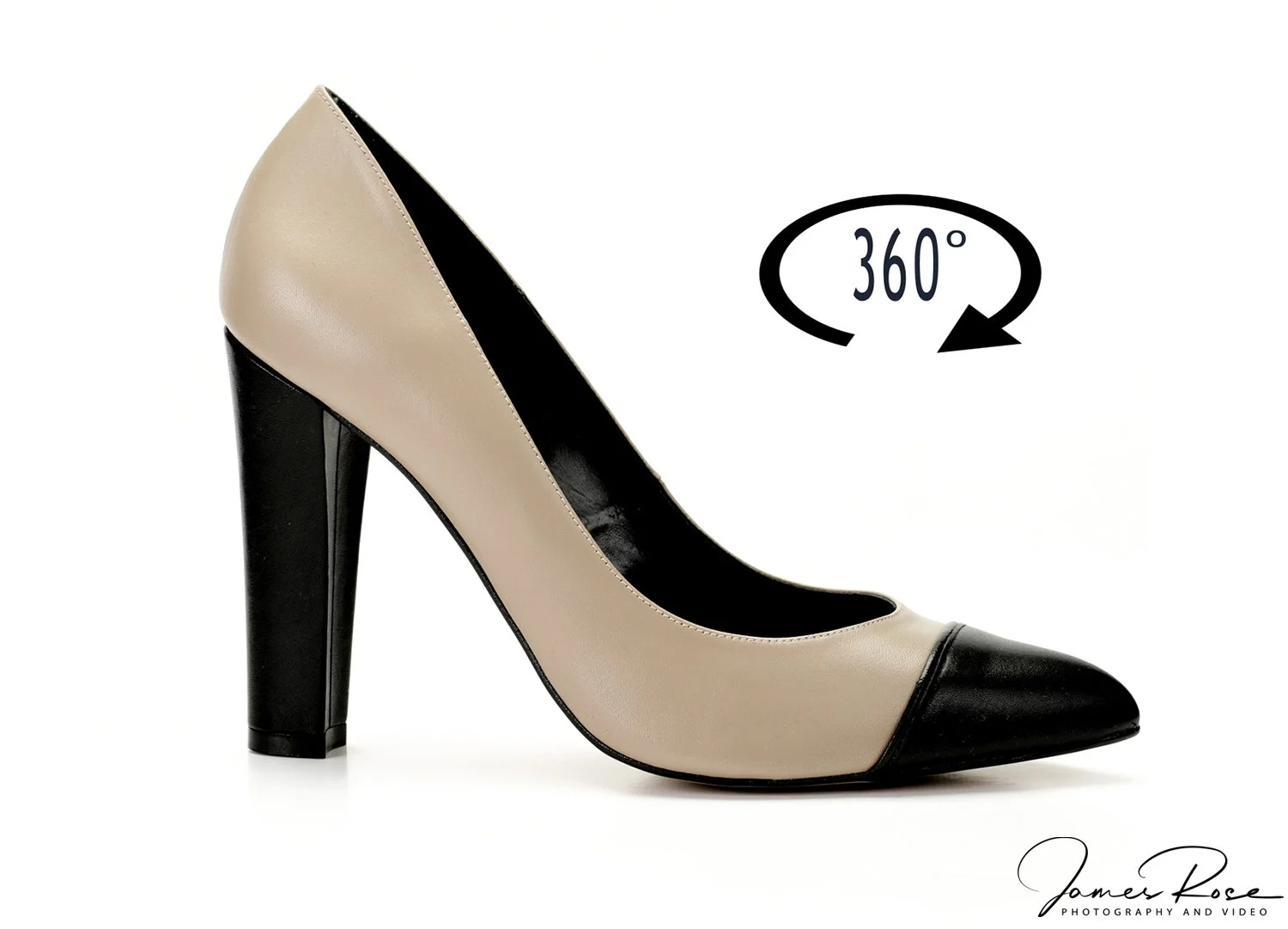 A beige and black high-heeled shoe with a pointed toe, featuring an icon indicating 360-degree rotation, on a white background with a signature at the bottom right corner.