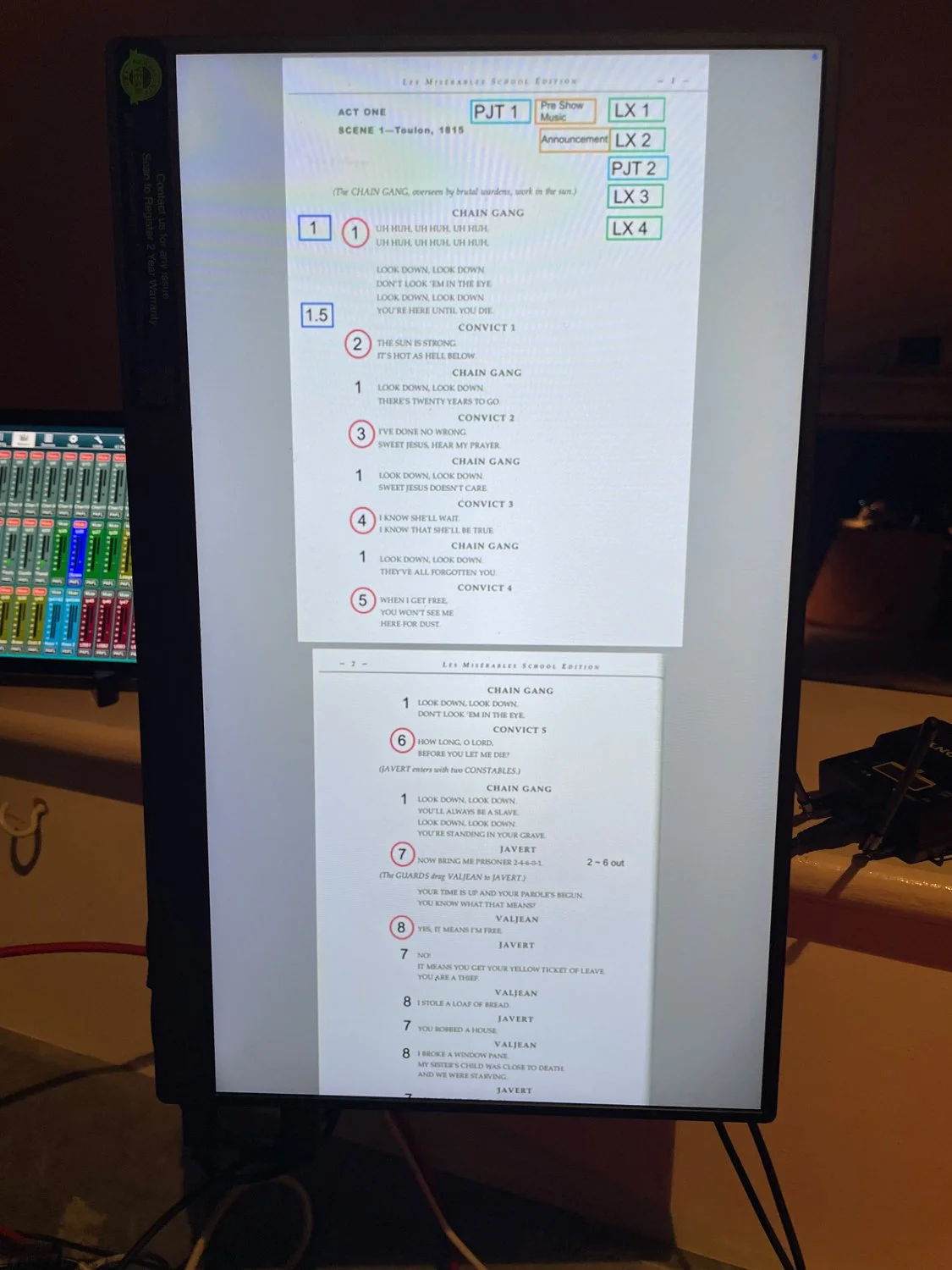 A printed script page for the play 'Les Misérables' on a display screen, showing the lyrics and dialogue for the song 'Chain Gang' and related scenes with annotations and scene details.