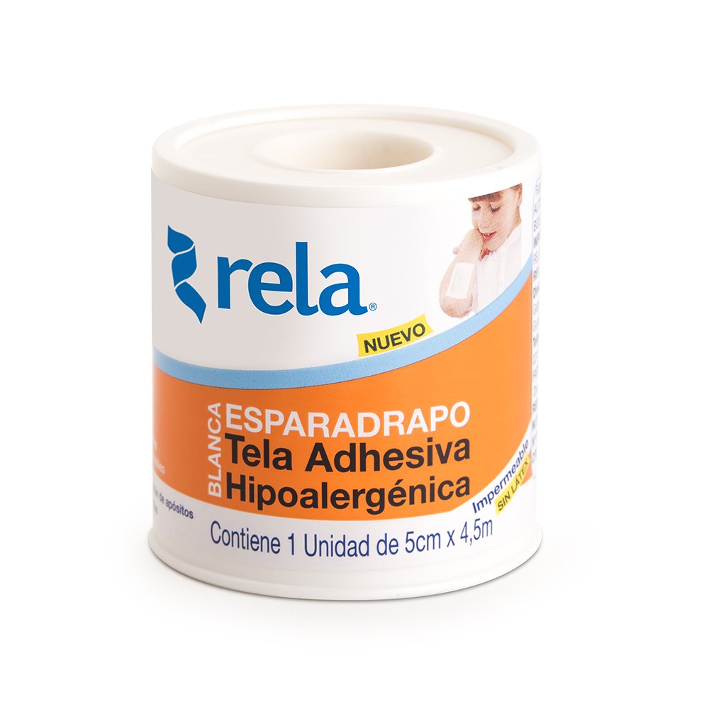 Mountain landscape with snow-capped peaks in the background, a grassy hill in the foreground, and a modern building with wooden and stone elements on the hill.