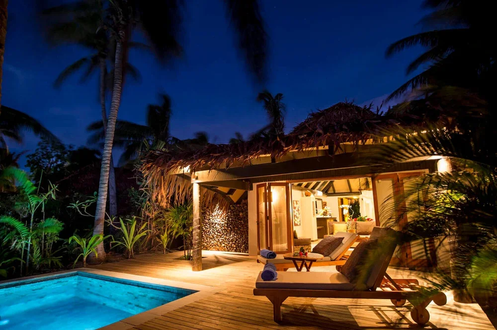 Tokoriki-Island-Resort-Resort-Fiji-Islands-Beachfront-Pool-Bure-Poolside-Romantic-Night-Lights.webp