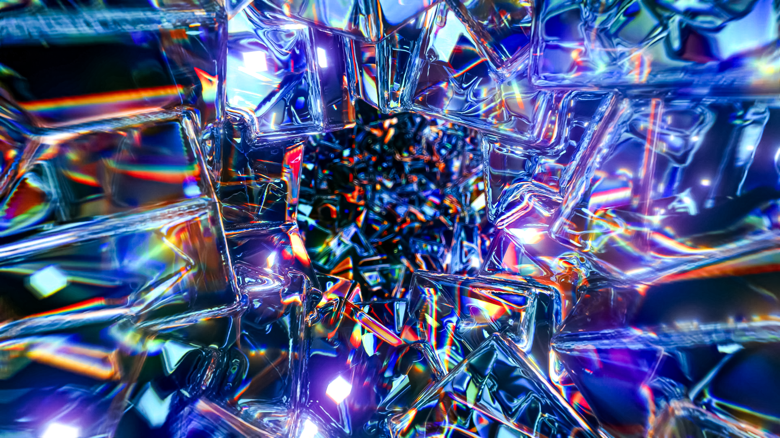 Colorful, reflective, shattered glass with a hole in the center, creating a tunnel-like effect.