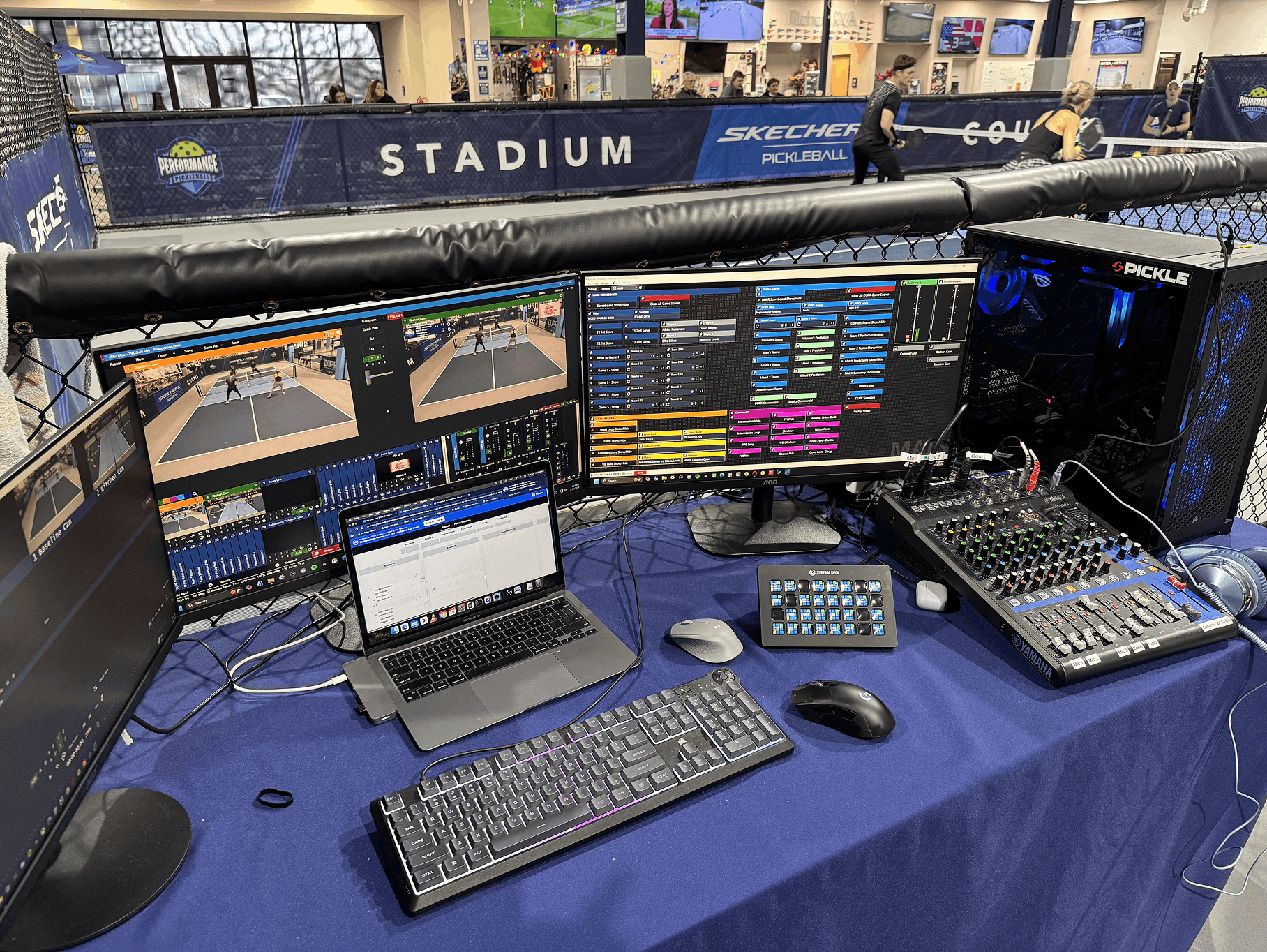 Performance Productions live stream production setup with multiple monitors and audio equipment at a pickleball court