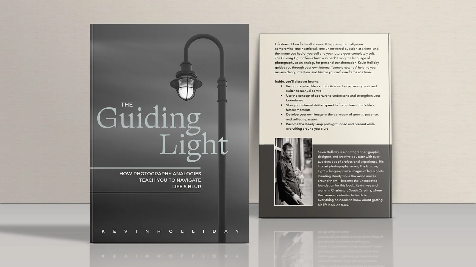 A book titled 'The Guiding Light' by Kevin Holliday standing next to a brochure with a black and white photo of the author, featuring a streetlamp illustration on the cover.