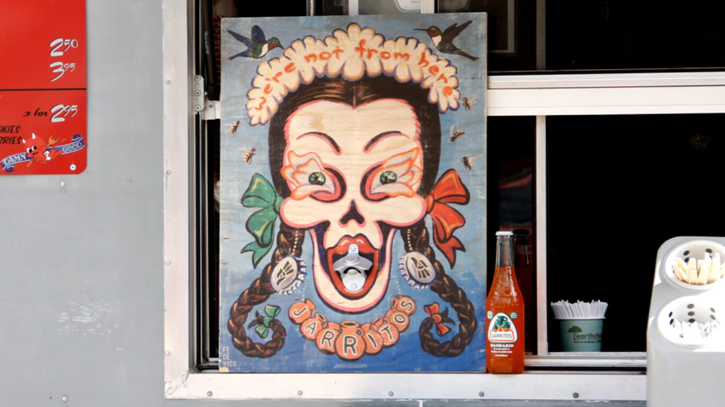 Jarritos promotional artwork displayed at a food truck featuring illustrated brand campaign creative