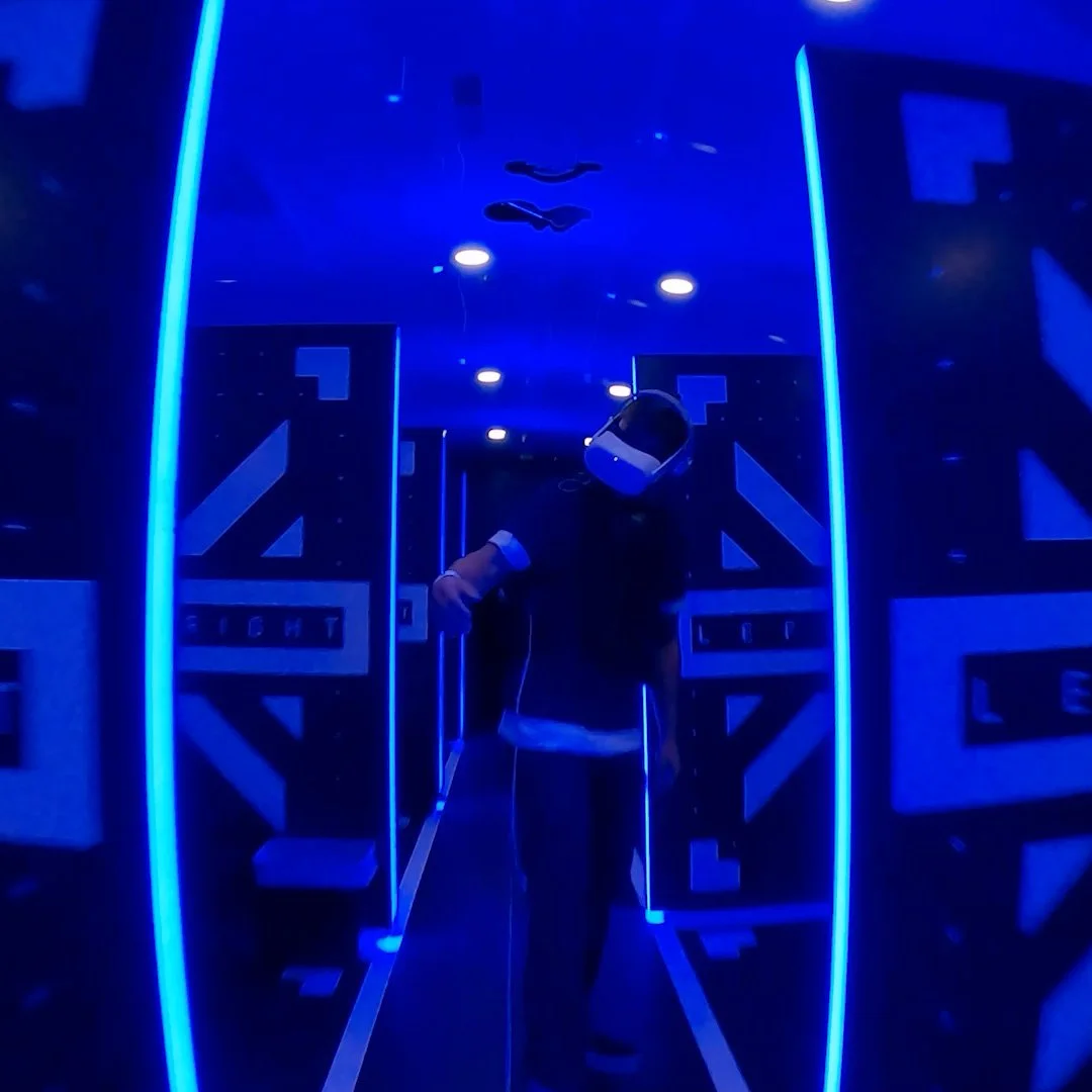 Person using virtual reality in a simulation room