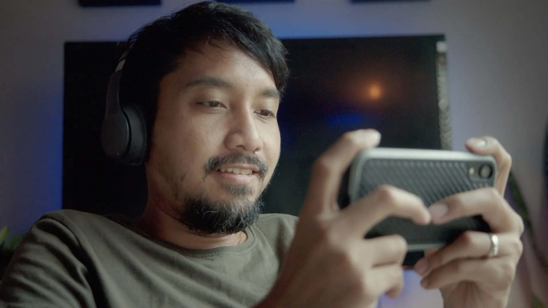 Player using a smartphone to experience Project E.C.H.O. cognitive gaming platform
