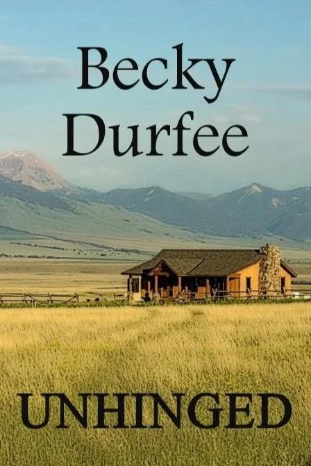 Unhinged book cover showing cabin in a field with mountains in the background