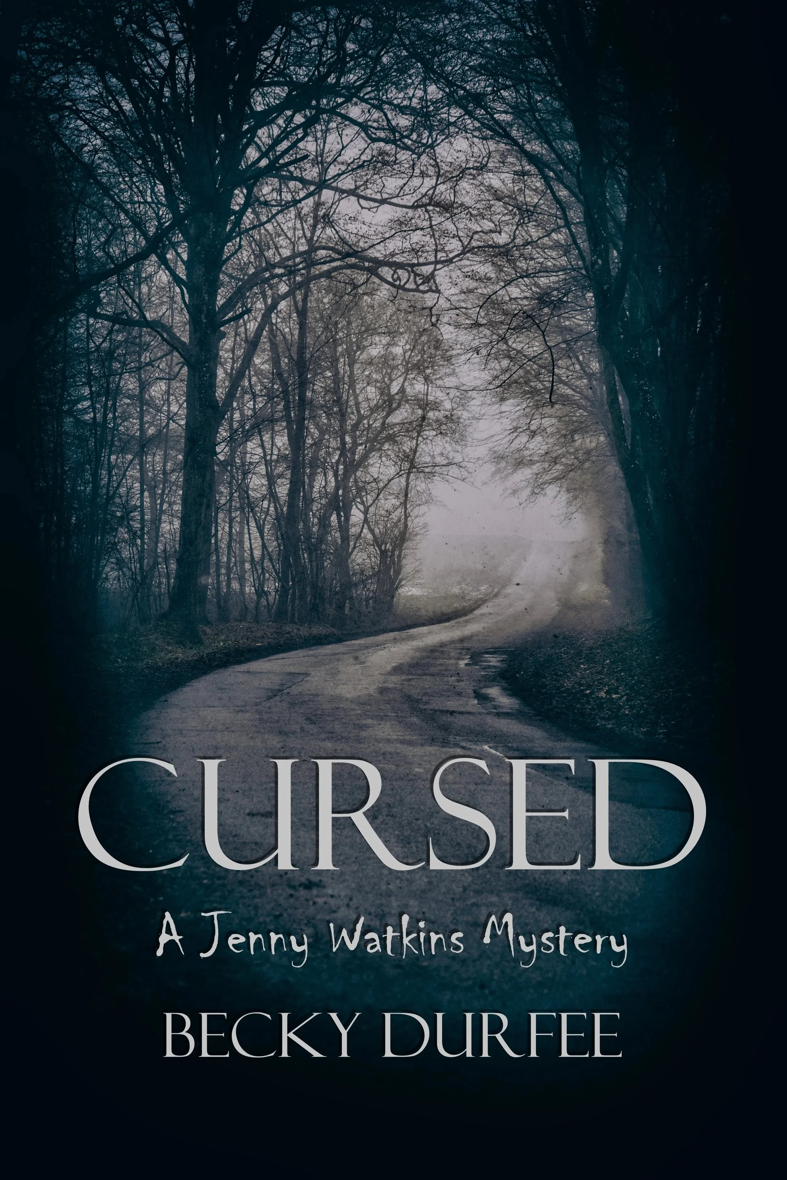Cursed book title showing a photo of a winding road through the woods.