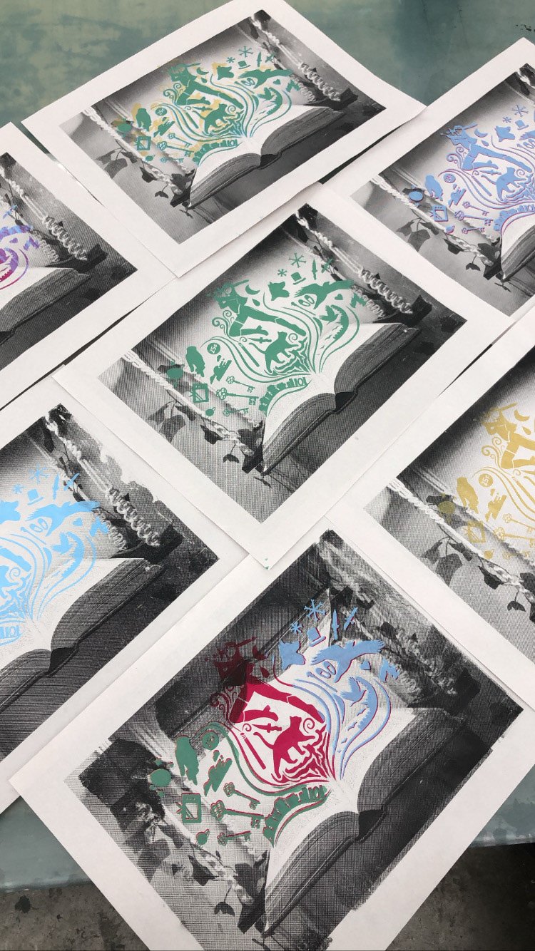 Different iterations of a layered screenprint depicting a book and relevant illustrations.