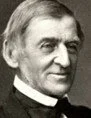 Black and white portrait photo of a man in a clerical collar, smiling.