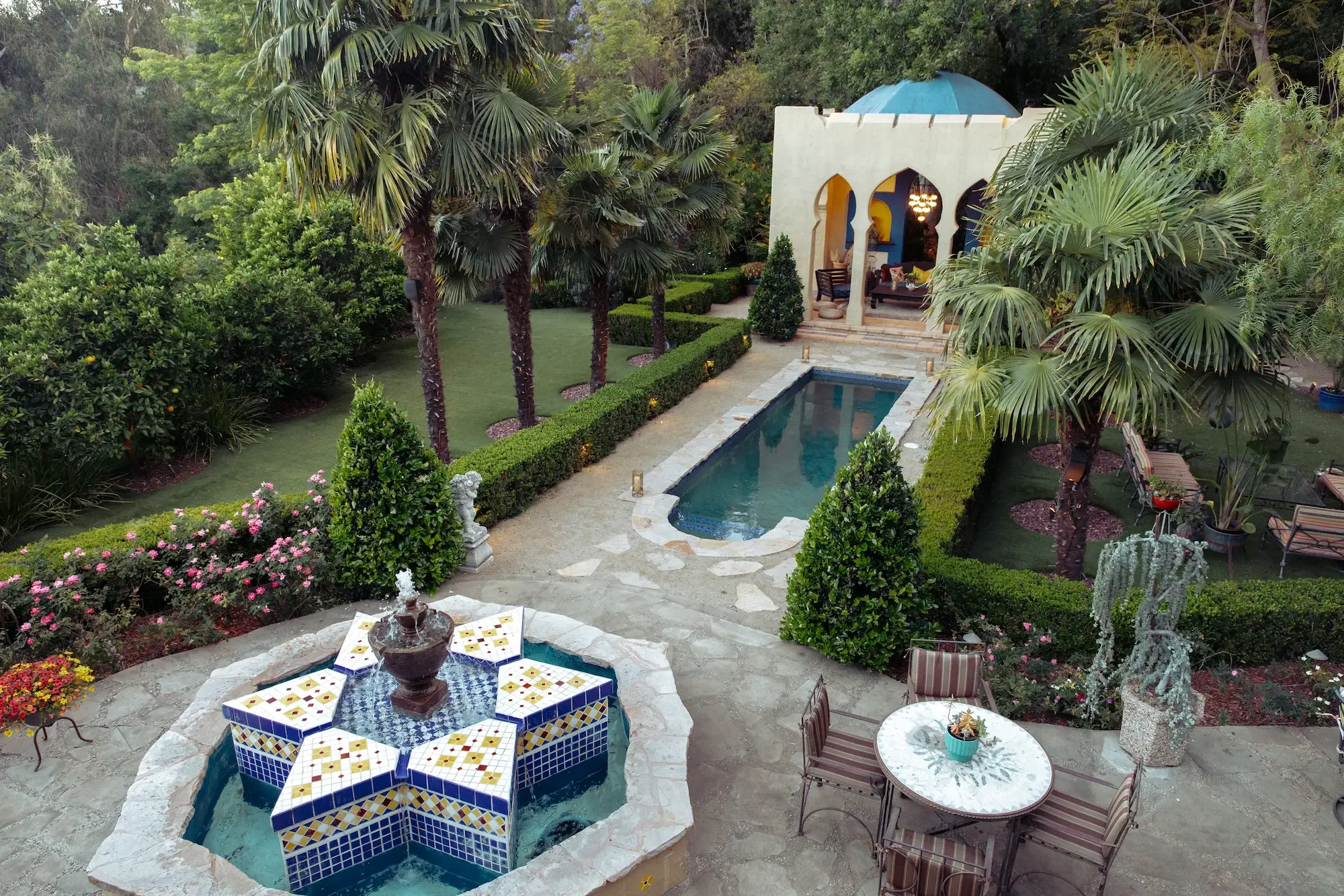 Elevated view of the Moroccan-inspired Kasbah, reflecting pool, fountains, and landscaped gardens at XOHH Events, a private production and filming location in the Hollywood Hills.