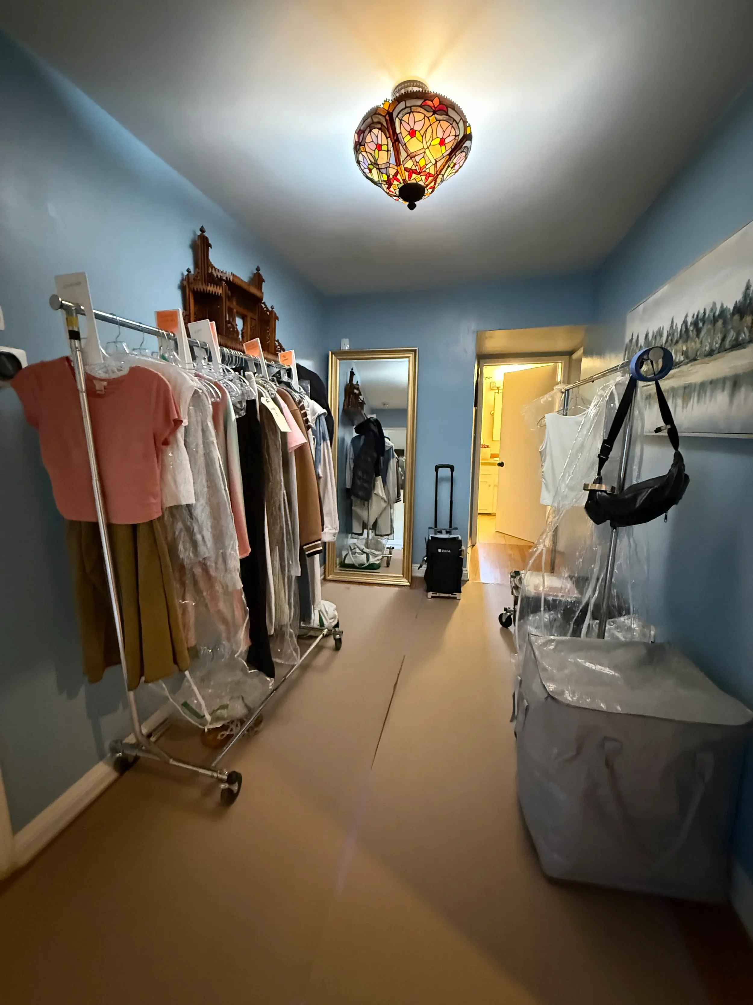 Wardrobe racks in an indoor production support space at XOHH Events in the Hollywood Hills.