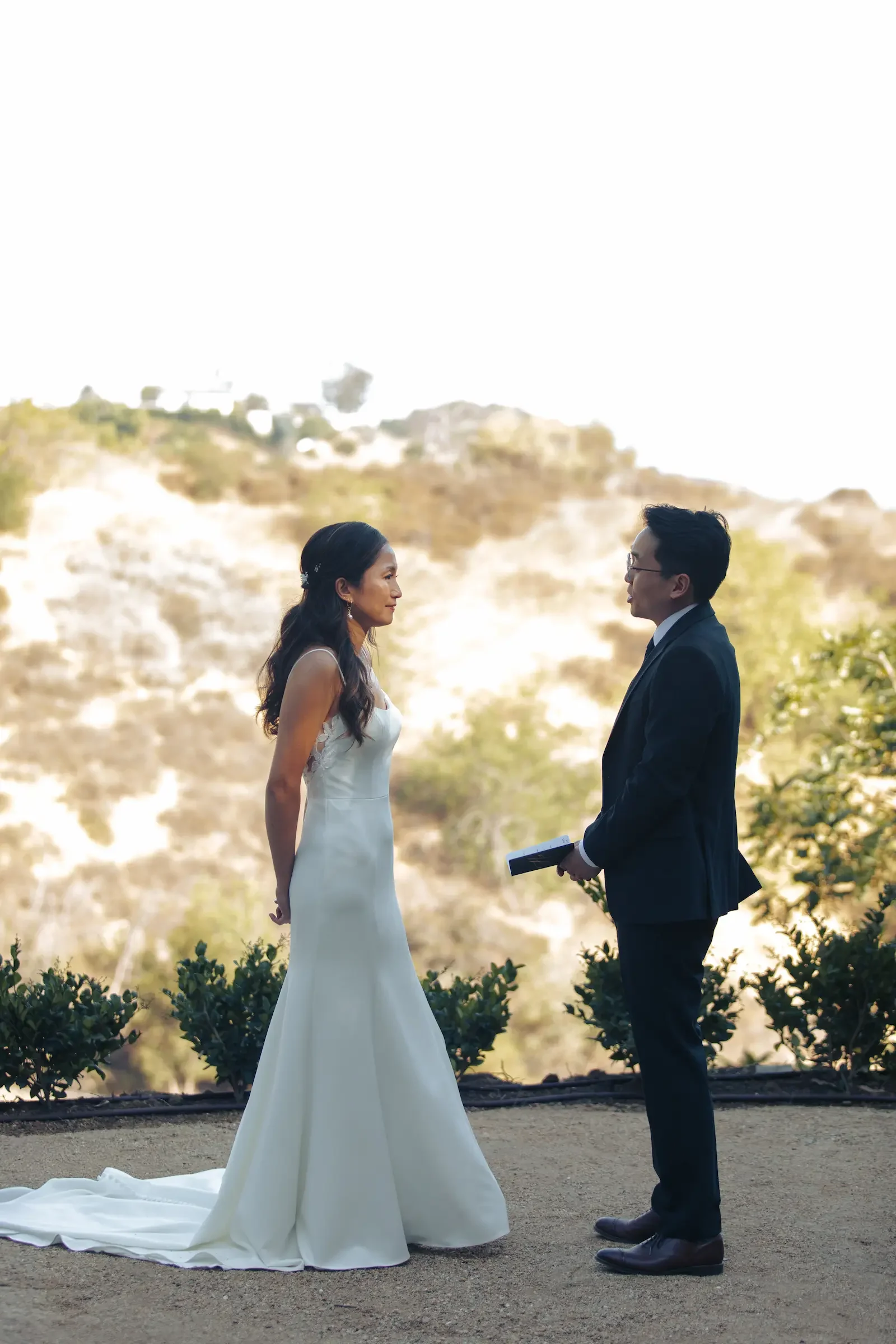 Wedding couple standing in the garden at XOHH Events, a private Hollywood Hills wedding venue in Los Angeles.