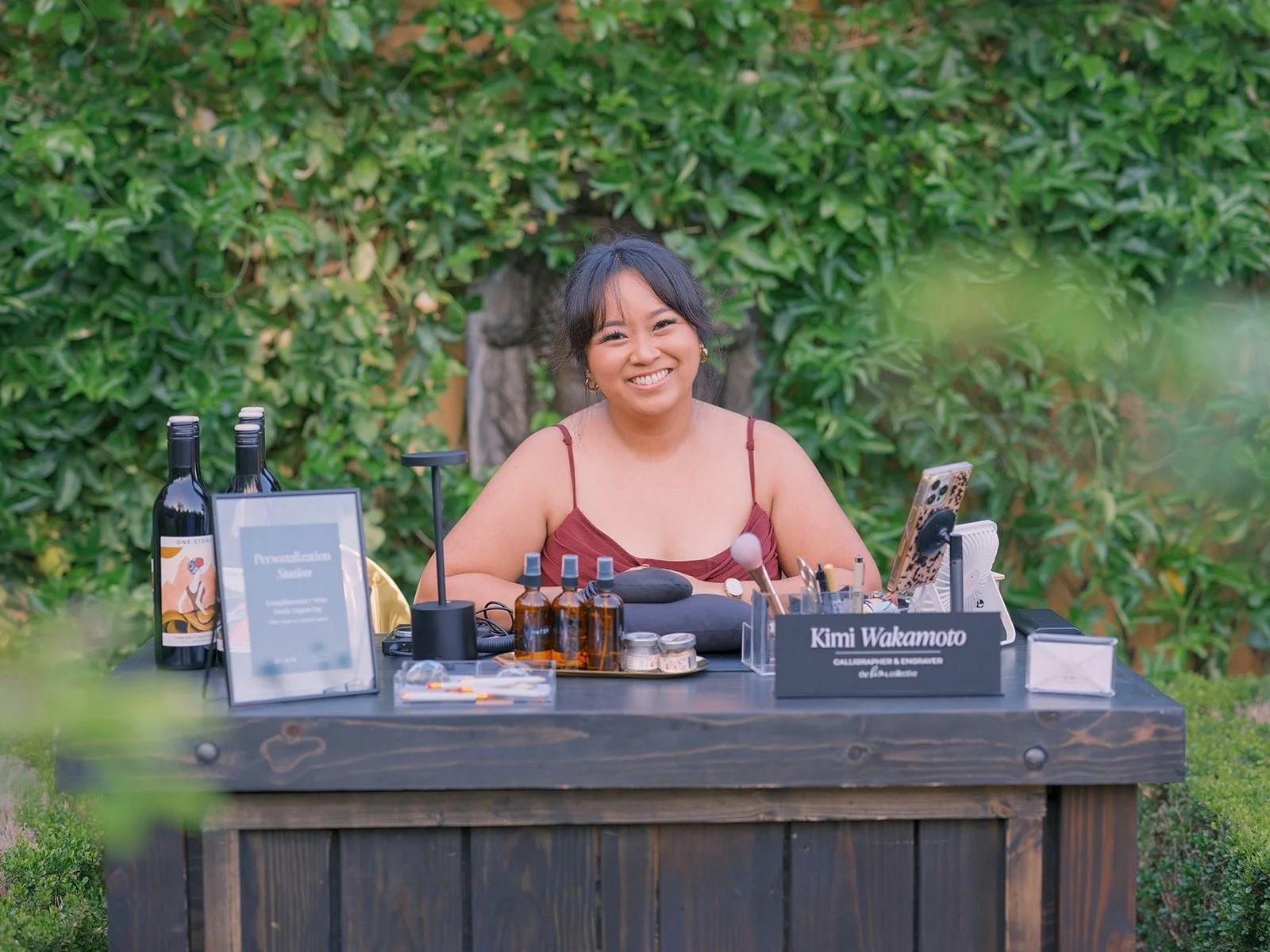 Host at the "Kimi Wakamoto" tasting station in the garden.